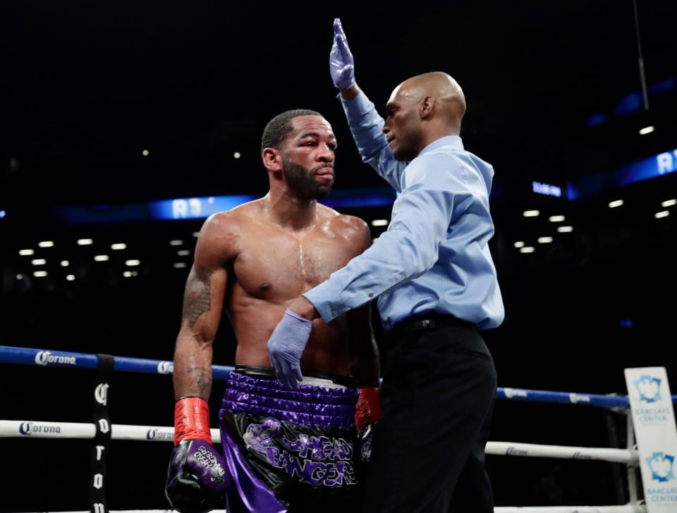 Referee calls the fight off in round 8 after Peterson's corner throw the towel in. Photo Credit: Associated Press, AP