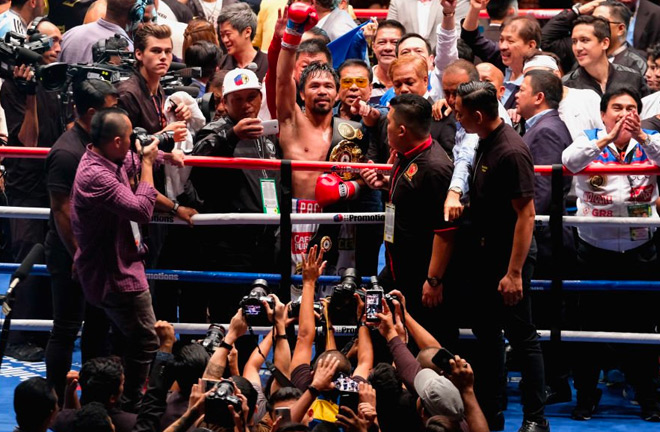 Manny Pacquiao celebrates his TKO victory over Lucas Matthysse.