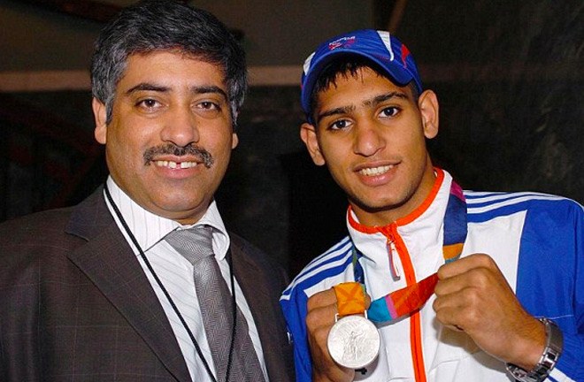 Amir Khan with his father, Shah, showing off his Silver Olympic Medal in 2004.