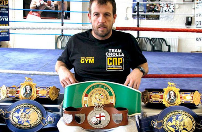 Joe Gallagher with titles won by his fighters. Photo credit: manchestereveningnews.co.uk