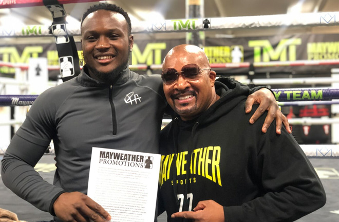 Viddal Riley with Leonard Ellerbe after signing a promotional deal with Mayweather Promotions. Photo Credit: Mayweather Promotions.