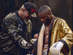 Derrick Osaze receiving the Ultimate Boxxer golden robe from Shannon Briggs. Photo Credit: London News Online