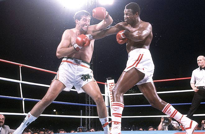 Larry Holmes facing Gerry Cooney in a bout that saw both men received their highest payday. Photo Credit: The Fight City