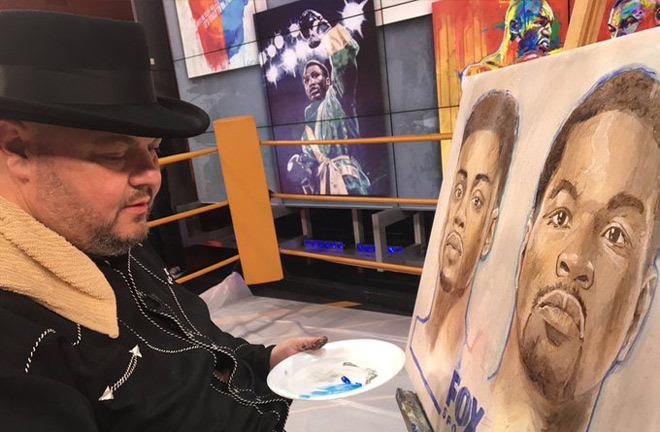 Slone in his new profession, painting, with his painting of his brother, Joe Frazier in the distance. Photo Credit: Richard T Slone