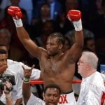 Lennox Lewis with Emanuel Steward (left) and Harold Knight (bottom, centre). Photo Credit: ESPN