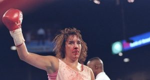 A bloodied and bruised Christy Martin, her defeats won't define her as she has fought her biggest fight outside of the ring. Photo Credit: Sportcasting.