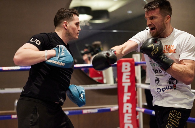 Fowler hits the pads with trainer Shane McGuigan during Wednesday's public training session in the bubble. Photo: Mark Robinson/Matchroom Boxing