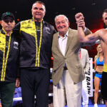 Lomachenko celebrates with his father (far left), manager Egis Klimas (centre left) and promoter Bob Arum (centre right) Photo Credit: Mikey Williams/Top Rank via Getty Images