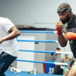 Woodley spent some time training with Hall of Famer, Floyd Mayweather Jr Photo Credit: Instagram @twooodley