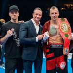 Mairis Briedis celebrates with his team after retaining his IBF cruiserweight world title Photo Credit: Mikus Klavins/ Wasserman Boxing