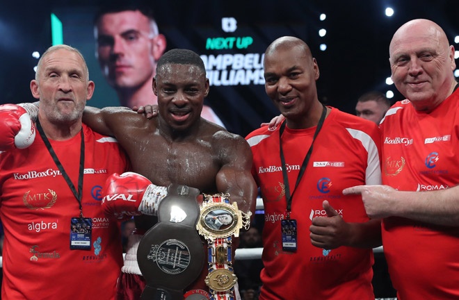 Azeez celebrates with his team after claiming the British belt Photo Credit: Lawrence Lustig/BOXXER