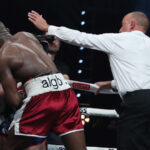 Referee John Latham stopped the fight after Azeez landed a barrage of punches Photo Credit: Lawrence Lustig/BOXXER