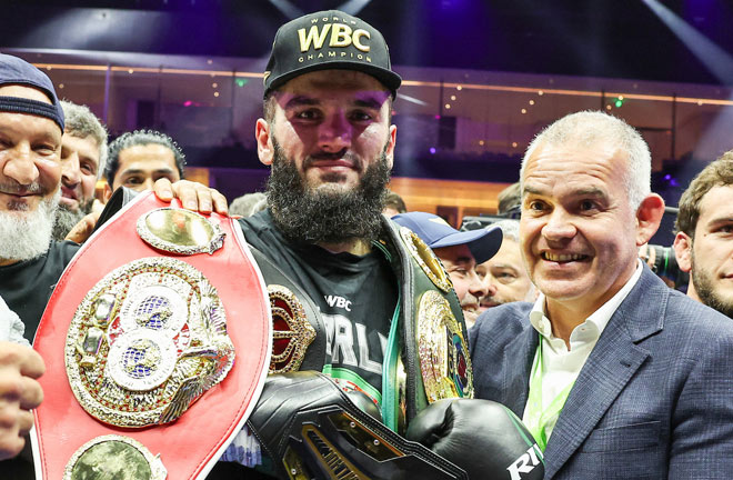 Beterbiev celebrates after defeating Bivol to become undisputed champion Photo: Leigh Dawney/Queensberry Promotions