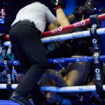 Whittaker and Cameron fell out of the ring Photo Credit: Mark Robinson Matchroom Boxing