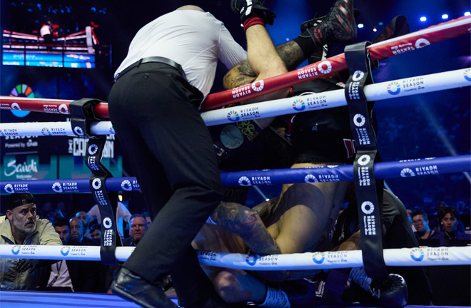 Whittaker and Cameron fell out of the ring. Photo: Mark Robinson Matchroom Boxing